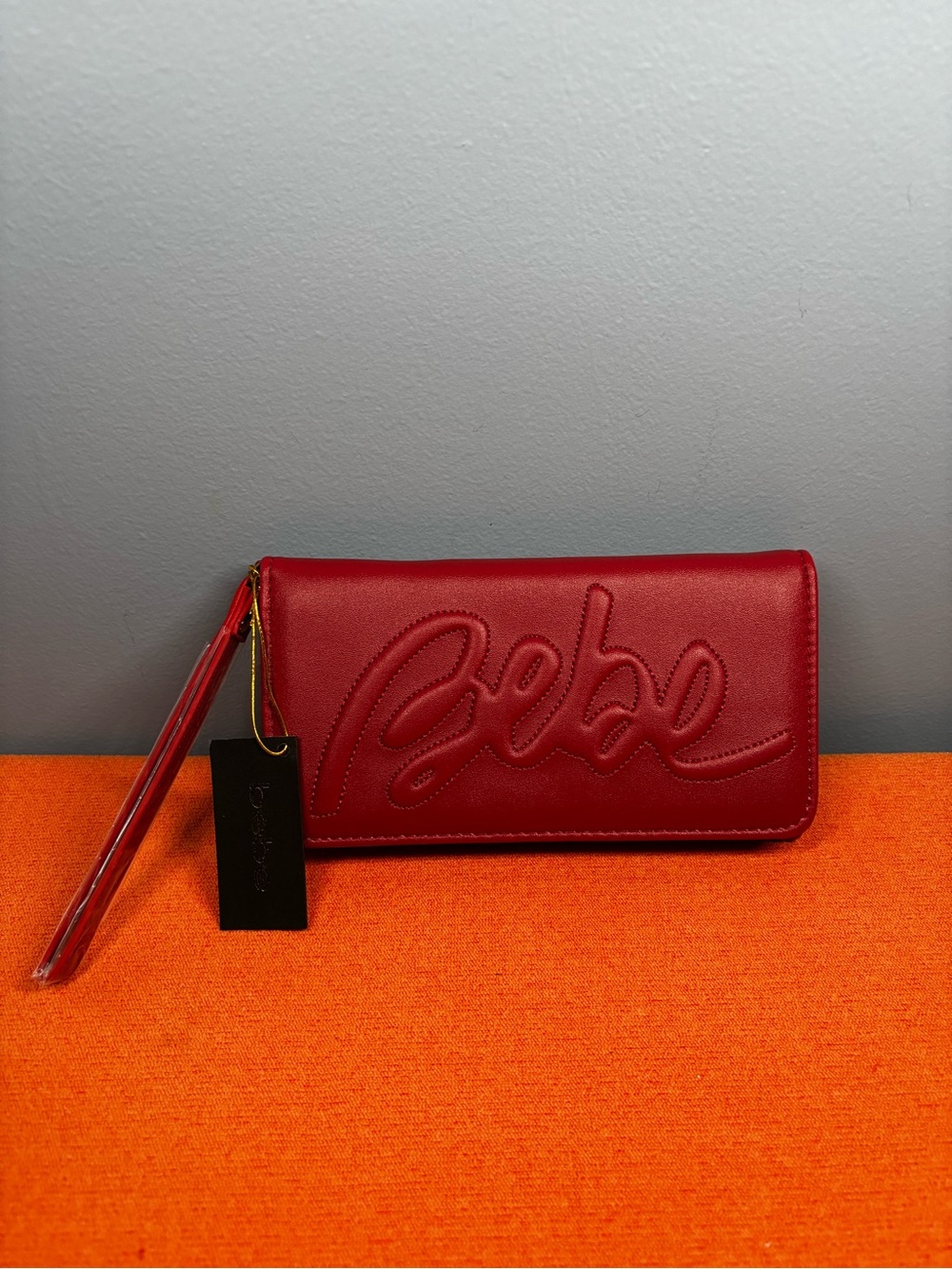 bebe Red Embossed Script Logo Wristlet
